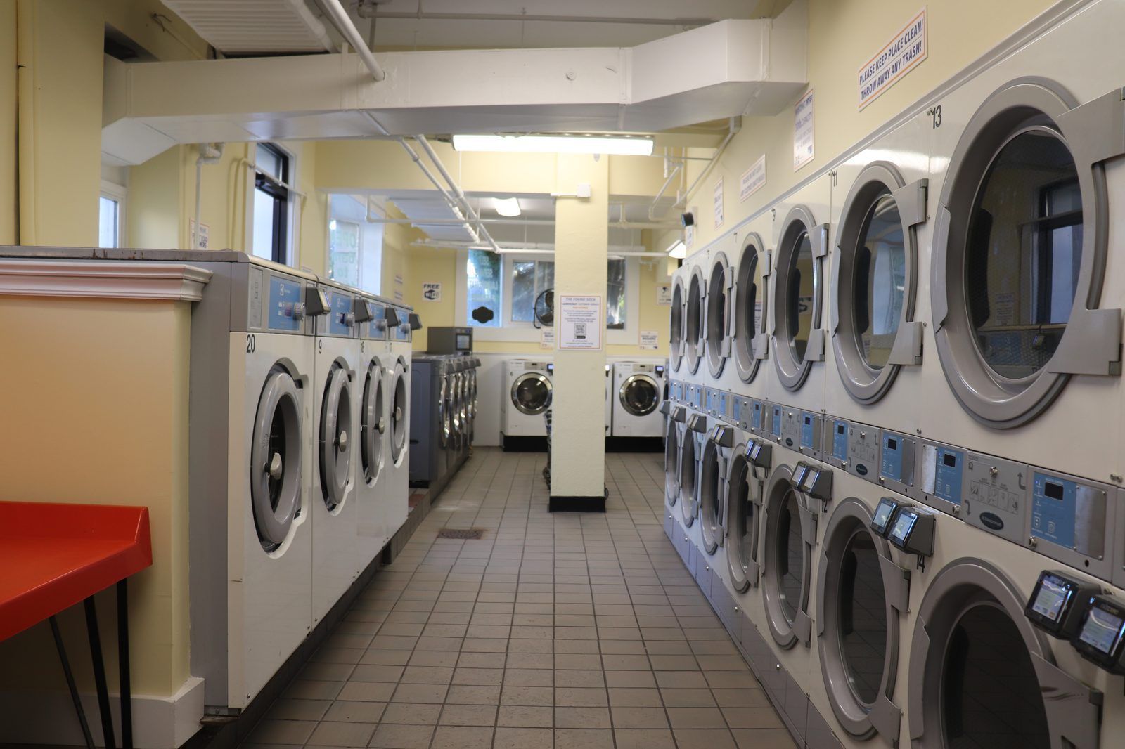 Inside the laundromat — washers on the left, dryers on the right